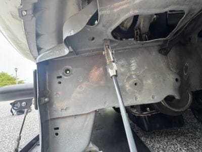 Clevis attachment for a side splitter support rod on the 1999 Honda Civic Si chassis