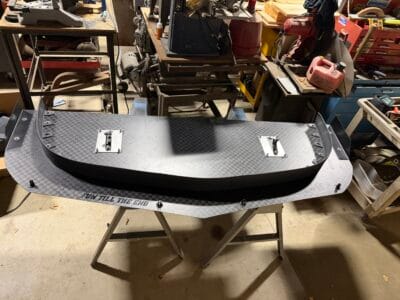 Finished homemade carbon splitter with quick-release receiver openings and support-rod mounting points