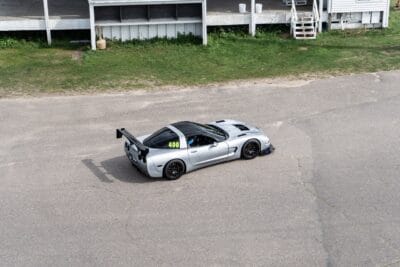 High-angle view of Justin Crews’ track-prepared C5 Corvette with a carbon splitter and rear wing