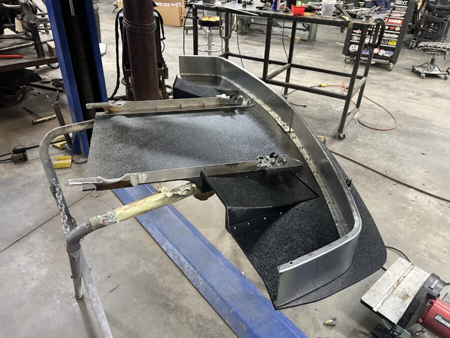 BMW E30 splitter assembly on a stand with hand-formed aluminum air dam, fabricated brackets, quick-release hardware, and diffusers.