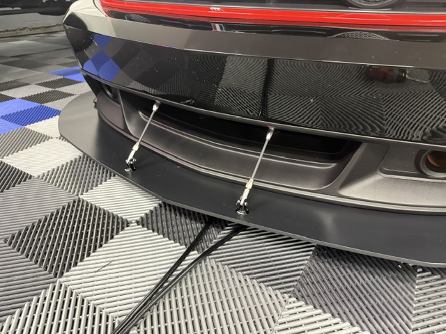 Front mounting layout of two Professional Awesome rods supporting the factory Boss 302 Laguna Seca splitter.