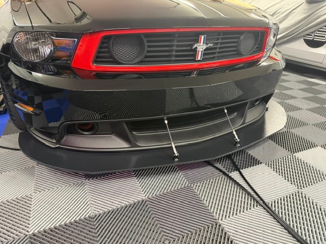 Front view of Jon’s 2012 Mustang Boss 302 Laguna Seca showing its factory splitter and replacement support rods.